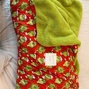 Posh Peanut Grinch Patterned Fleece Throw in Red and Green